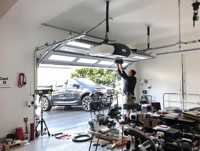 Garfield Heights Garage Door Repair specialist installing smart garage door opener system in Garfield Heights home