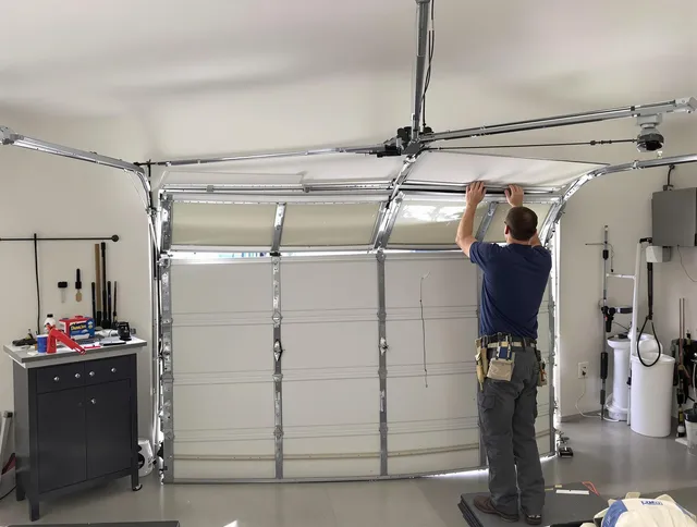 Garfield Heights Garage Door Repair specialist performing precise section replacement on Garfield Heights garage door